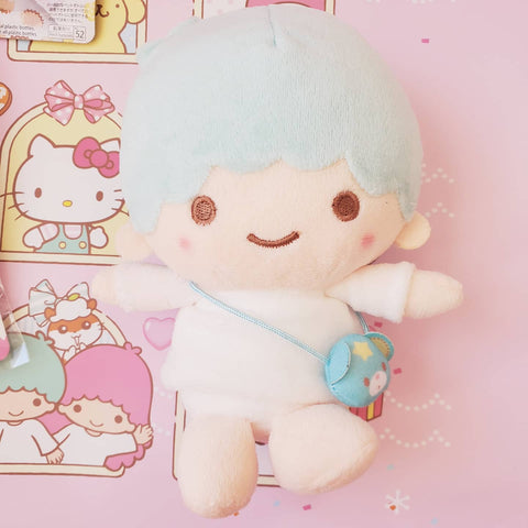 Kiki plush wearing bear pouch