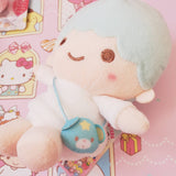 Kiki plush wearing bear pouch